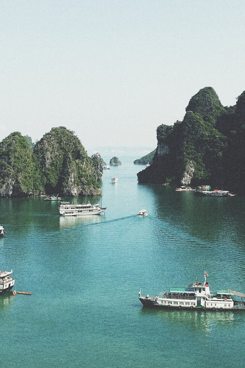 A breathtaking view of Halong Bay with boats navigating through limestone islands.